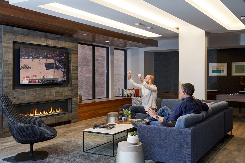 Resident club lounge with cozy fireplace at Nightingale, Providence, 02903,