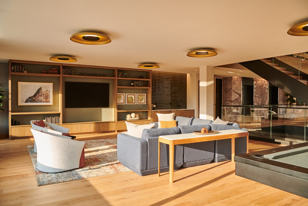 a living room with couches and chairs and a table