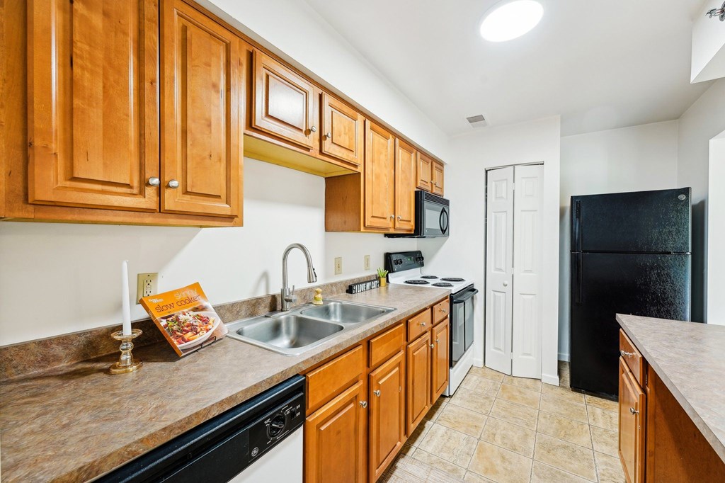 Kitchen with beautiful oak cabinets  at The Reserve at Reed Farm