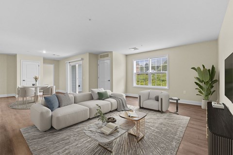 A living room with a grey sofa and a coffee table.