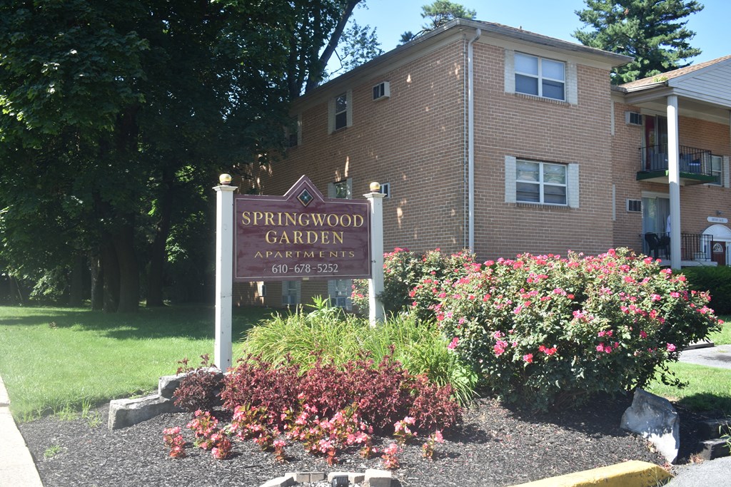 an image of the springwood garden sign in front of a building