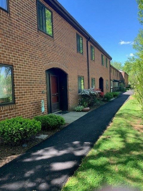 A walkway on a sunny day at Cambridge Commons Apartments