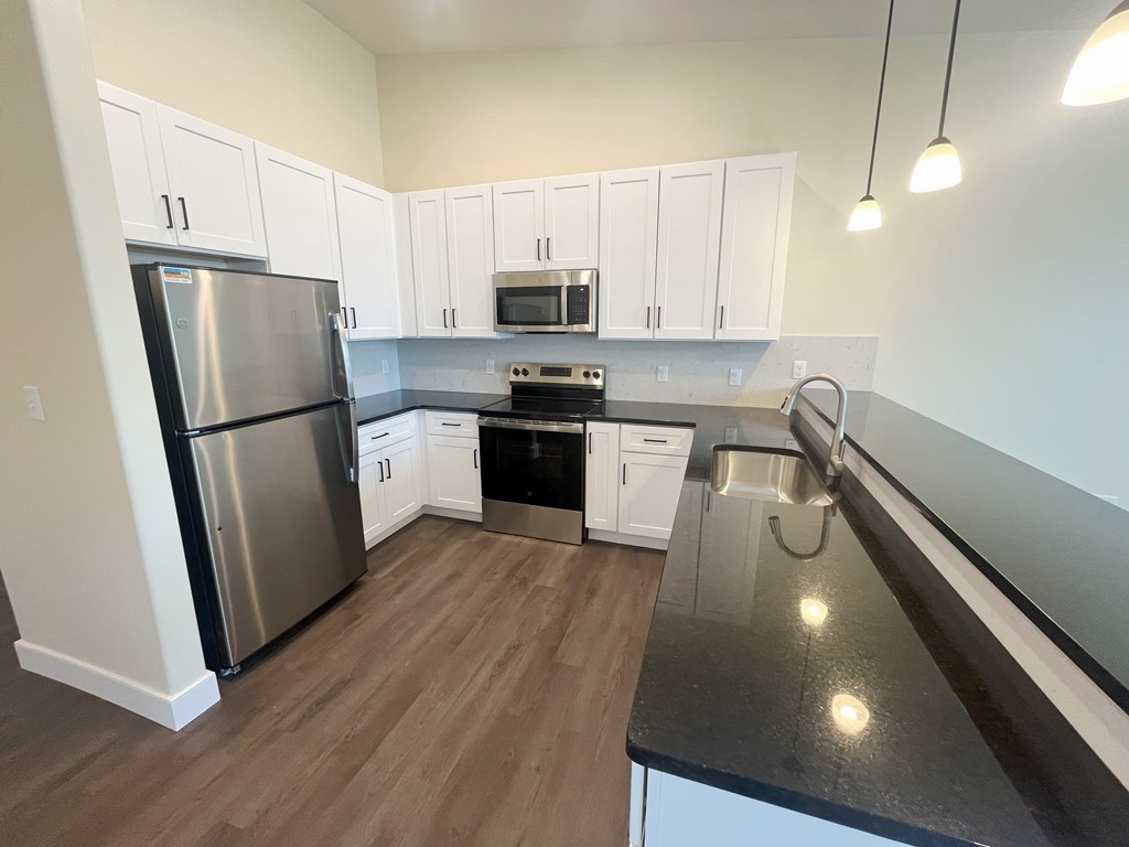 Closer View of the kitchen with stunning black countertops Beautiful, Spacious Kitchen with stunning black granite countertops at Ponds at Village Greens