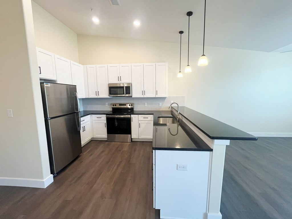 Beautiful, Spacious Kitchen with stunning black granite countertops at Ponds at Village Greens