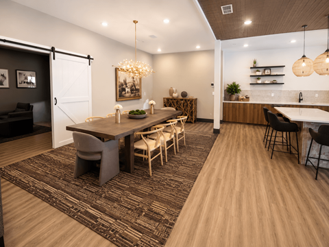 A modern dining room with a wooden table and chairs.