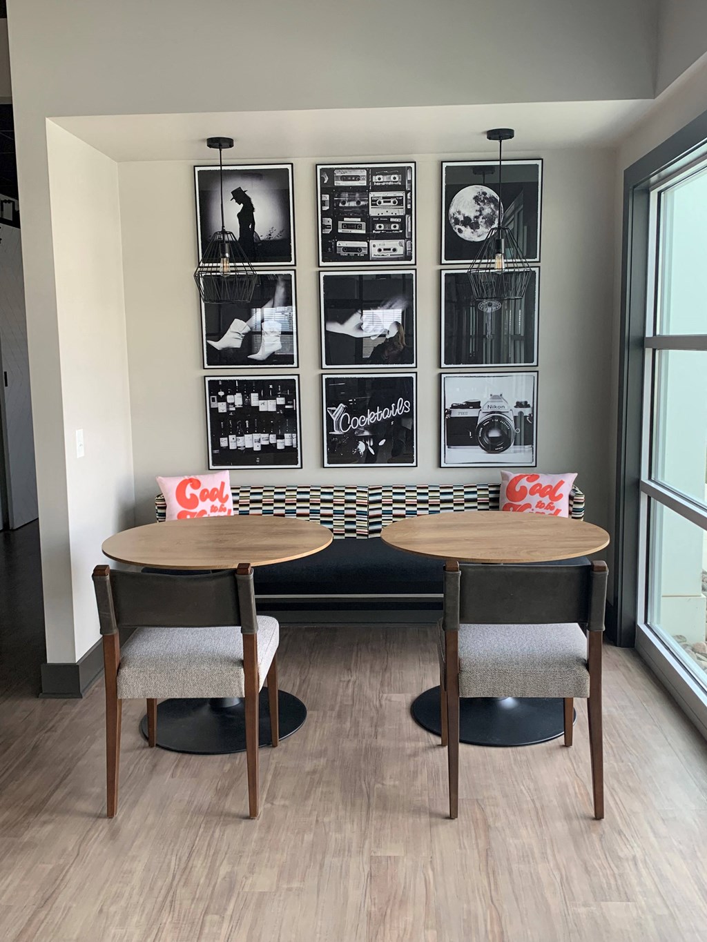 Sitting area tables and bench at the reserve at rivers edge clubhouse