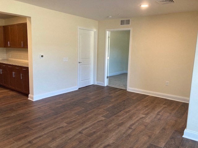 Apartment dining room with hardwood floors at the reserve at rivers edge