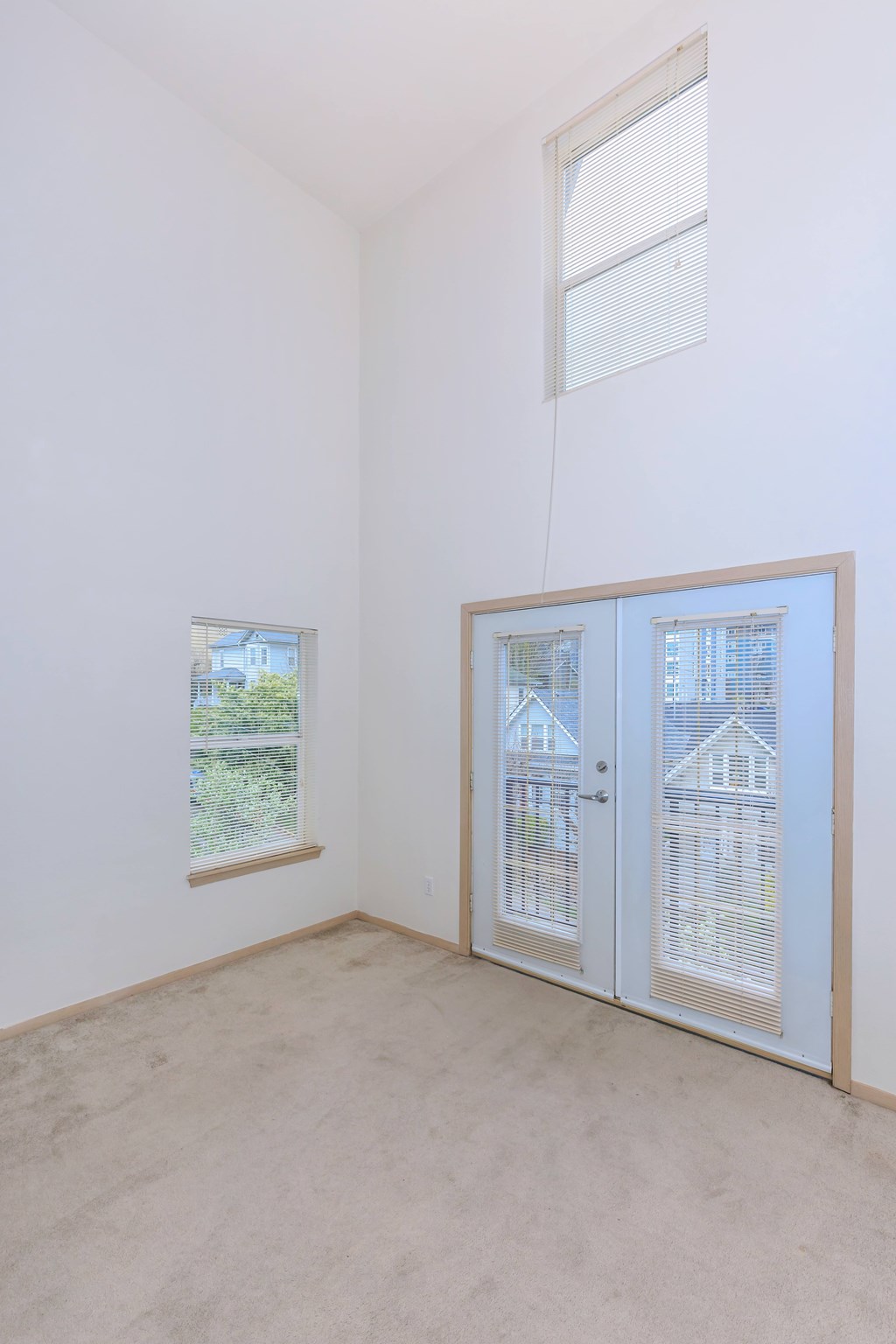 A room with a window and a door.