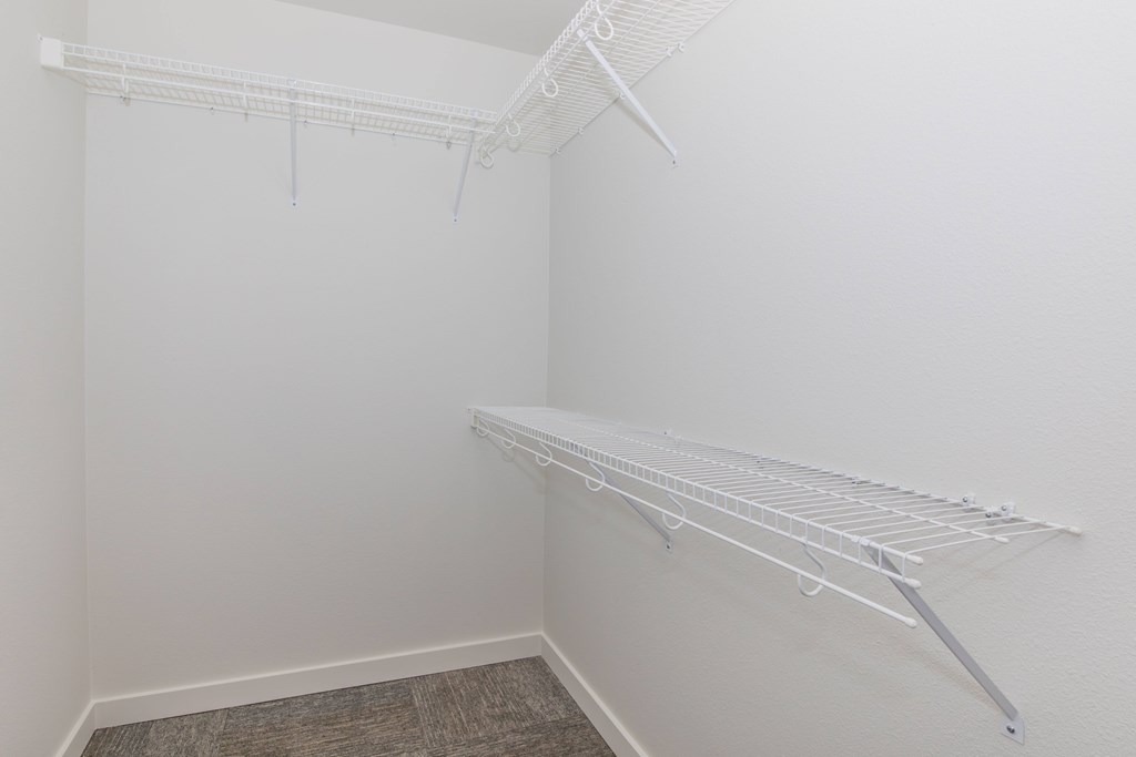 Empty white shelving unit in a room.