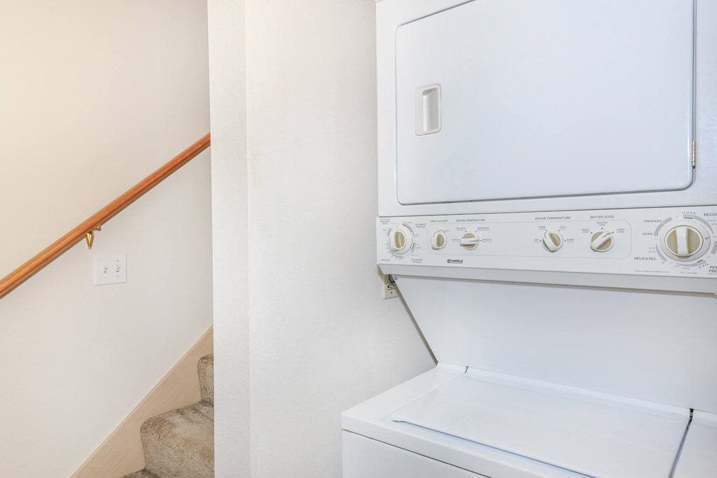 A white washing machine with the number 1 on it.