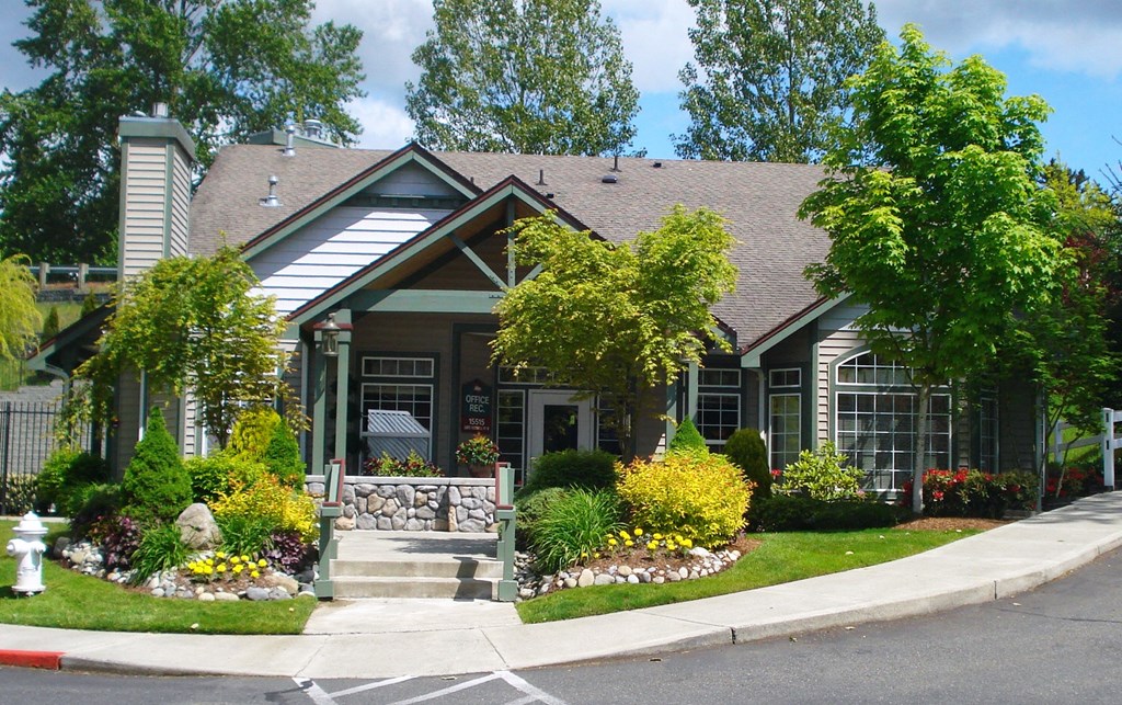 A house with a front yard and a fire hydrant.