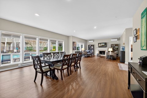 A dining room with a table and chairs is shown.