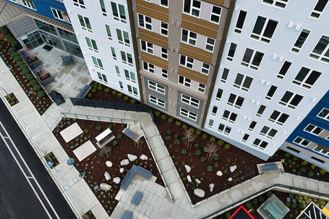 A view of a courtyard between two buildings.