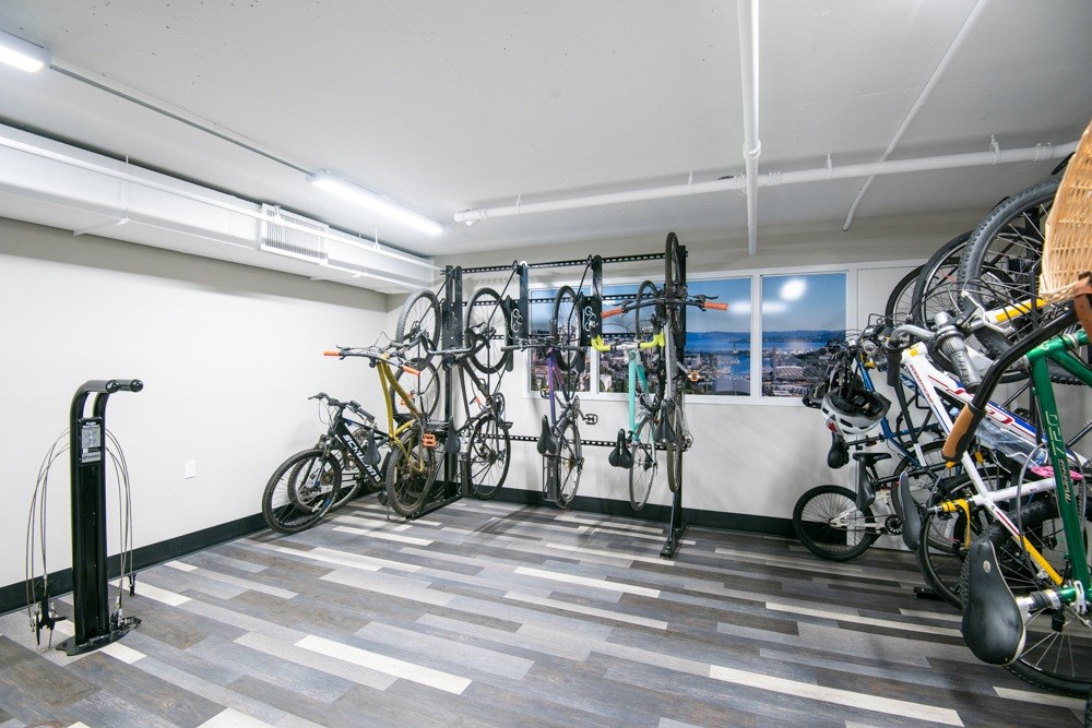 A bike rack with bicycles in a room.