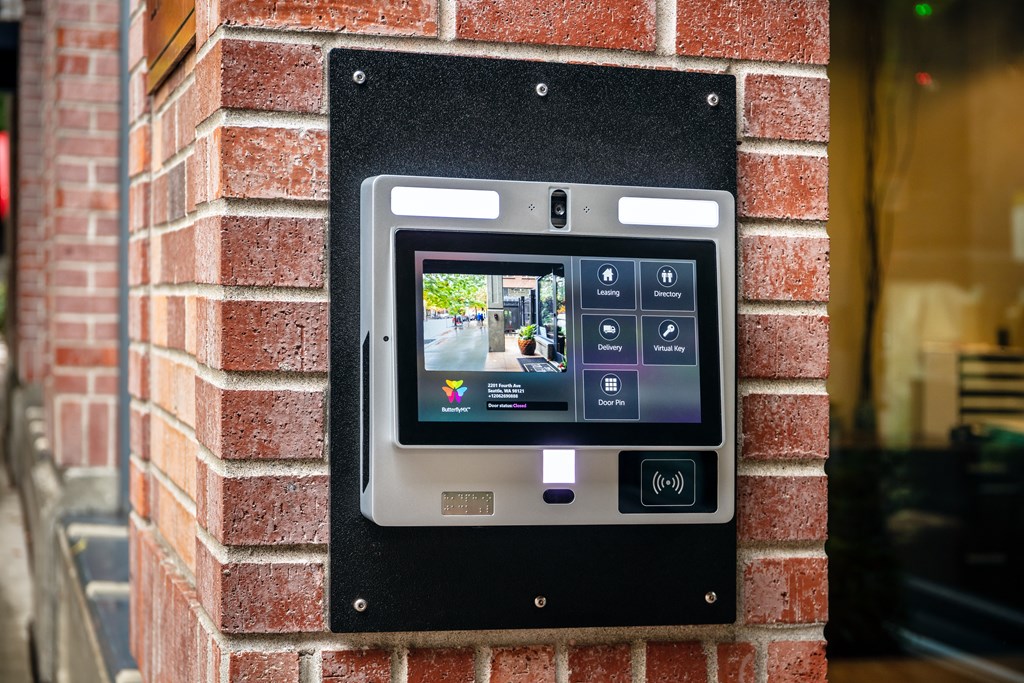 A digital display on a brick wall.