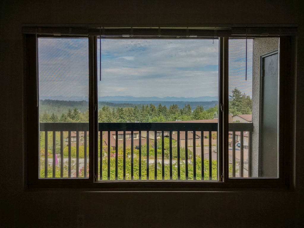 A view of a mountain range from a window.