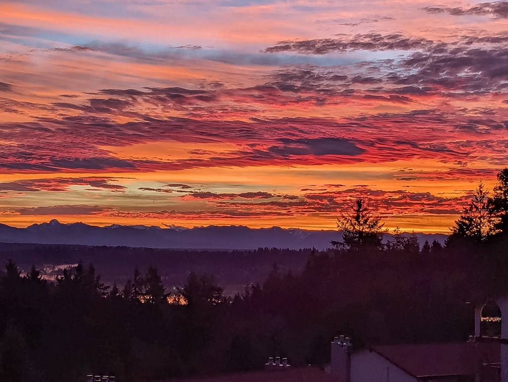 A beautiful sunset with a mix of orange, pink, and purple hues in the sky.