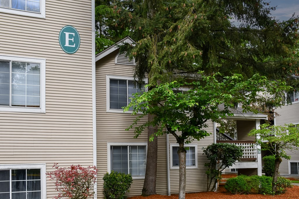 A building with a green letter E on the side.