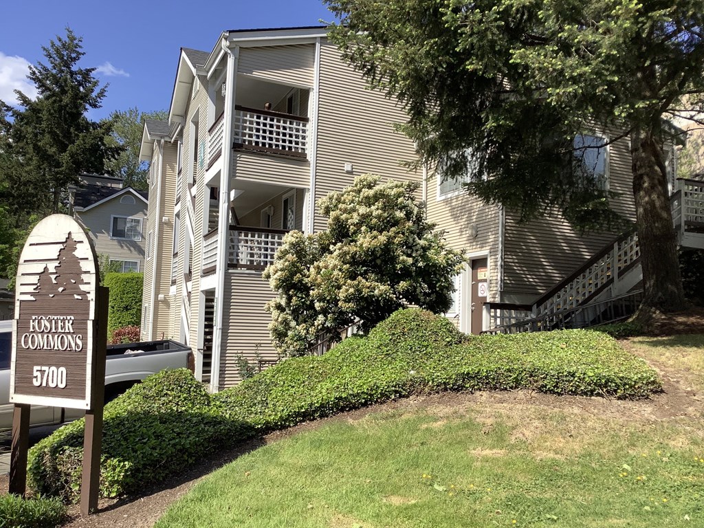 A sign in front of a building that says "Foster Commons 5700".