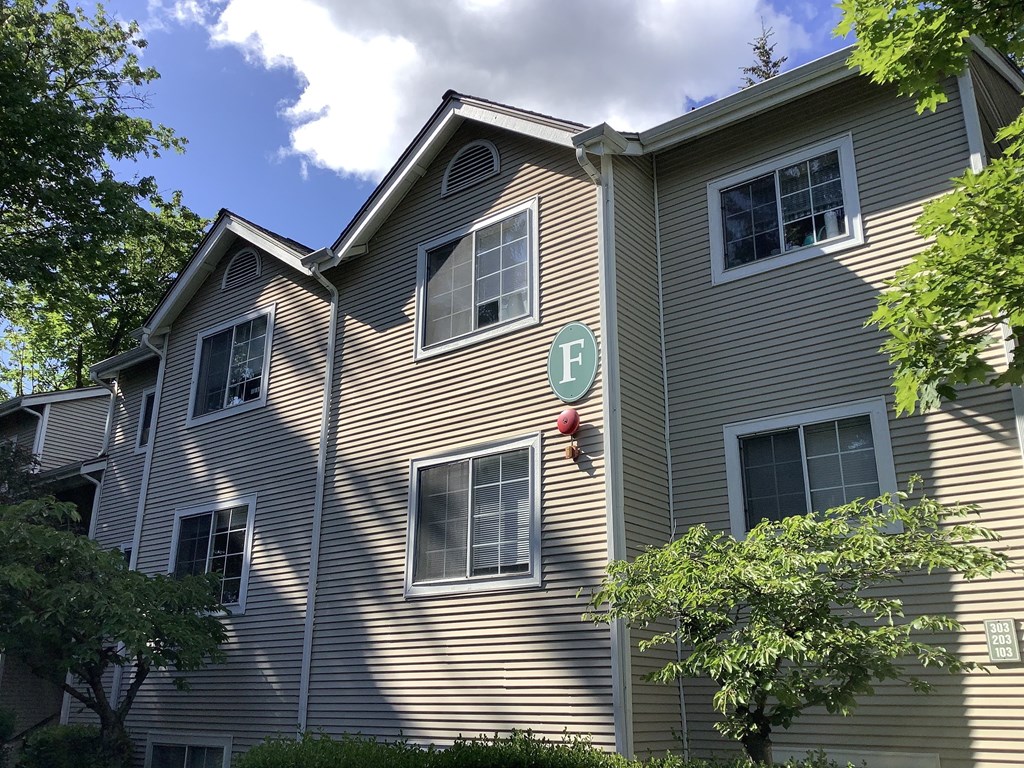 A building with a green letter F on it.