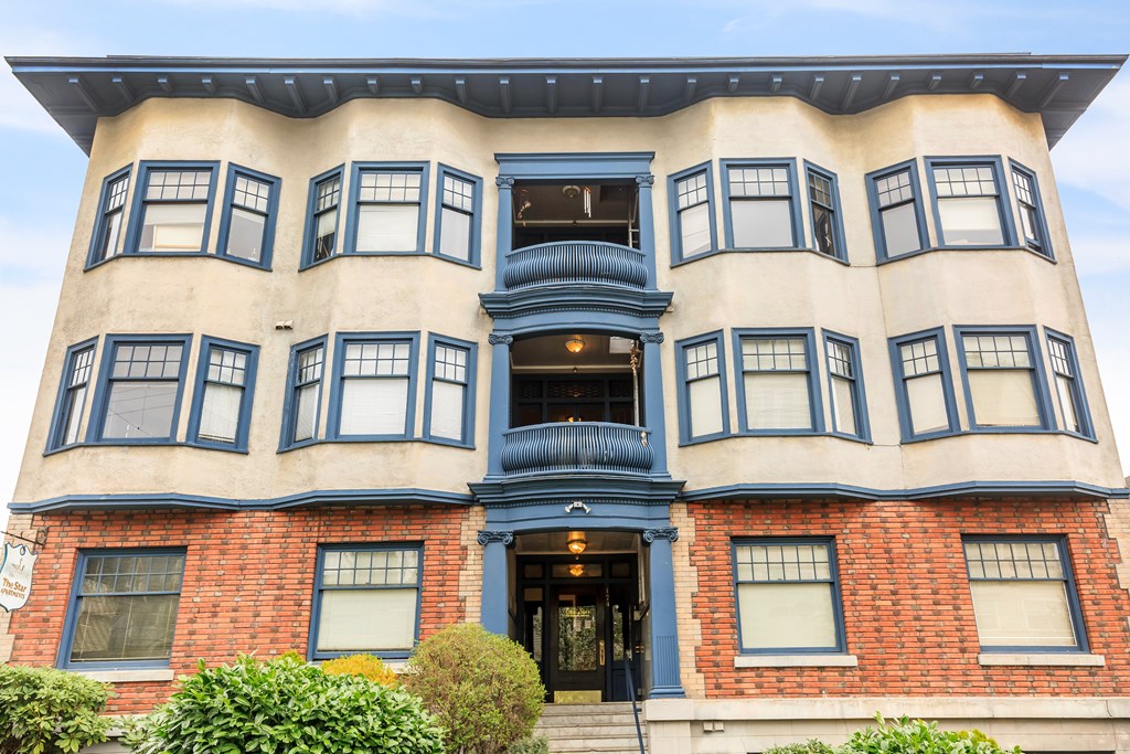 A large building with a blue door and windows.