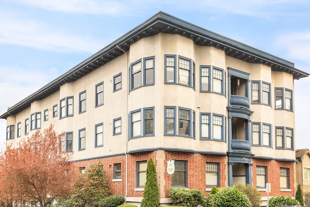 A large building with a balcony on the second floor.