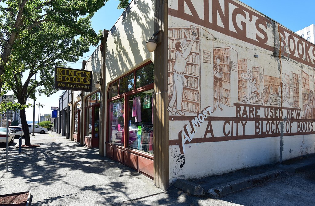 A book store named King's Books is located on a sidewalk.
