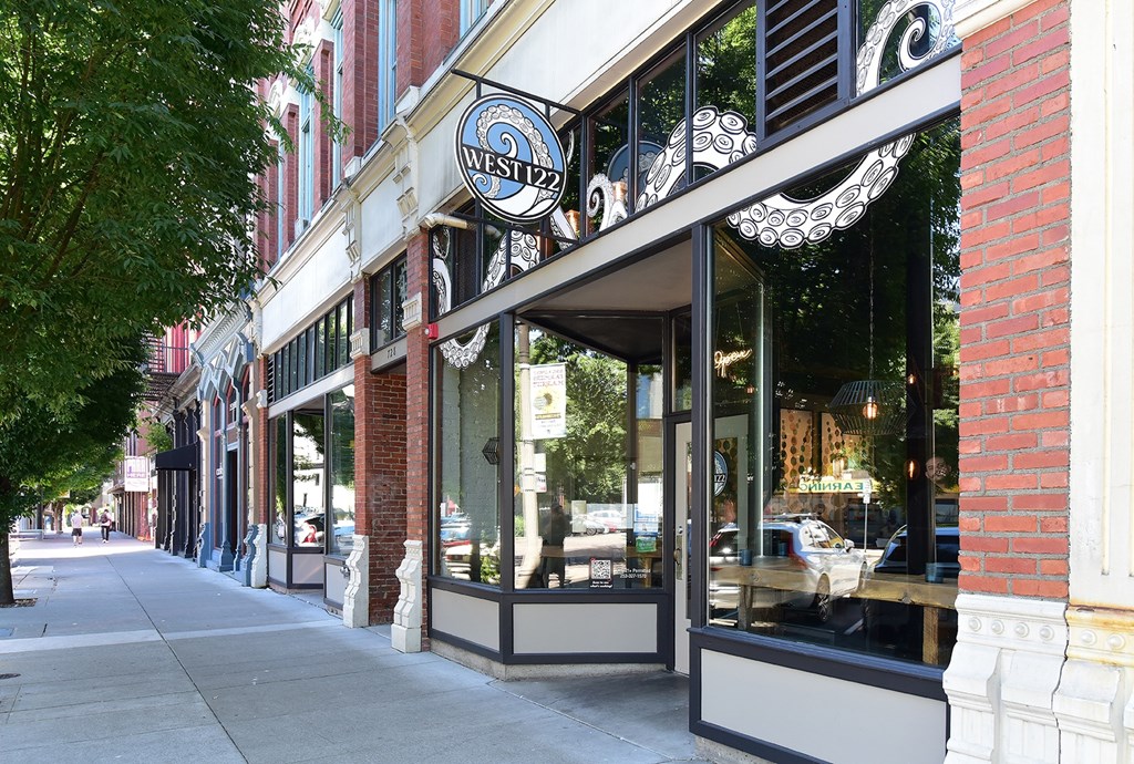 A storefront with a sign that says West 127.