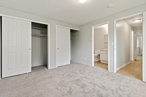 A white door is open to a bathroom.