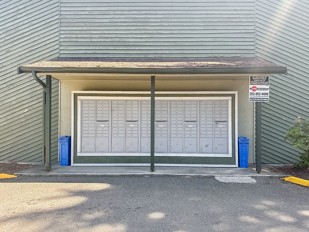 A garage door with a sign above it that says "No Parking".