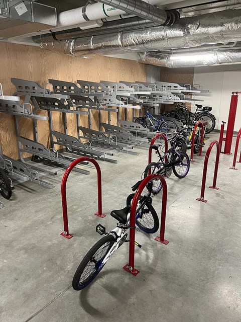 A bike is parked in a bike rack.
