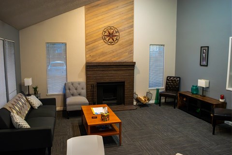 A living room with a fireplace and a couch.