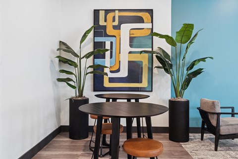A modern dining area with a round table and chairs.