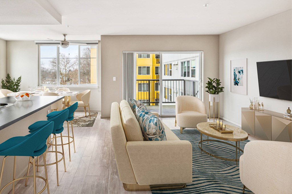 A modern living room with a bar area and a view of a yellow building outside.