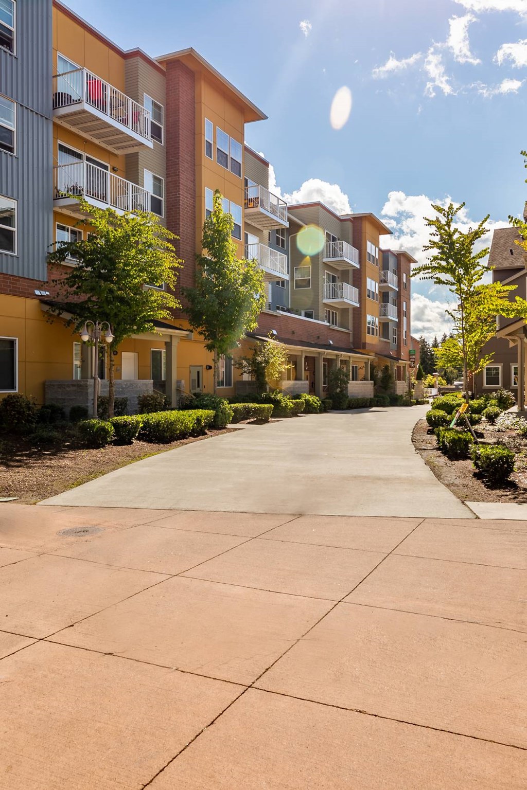 A sunny day at a residential building with a clear blue sky.