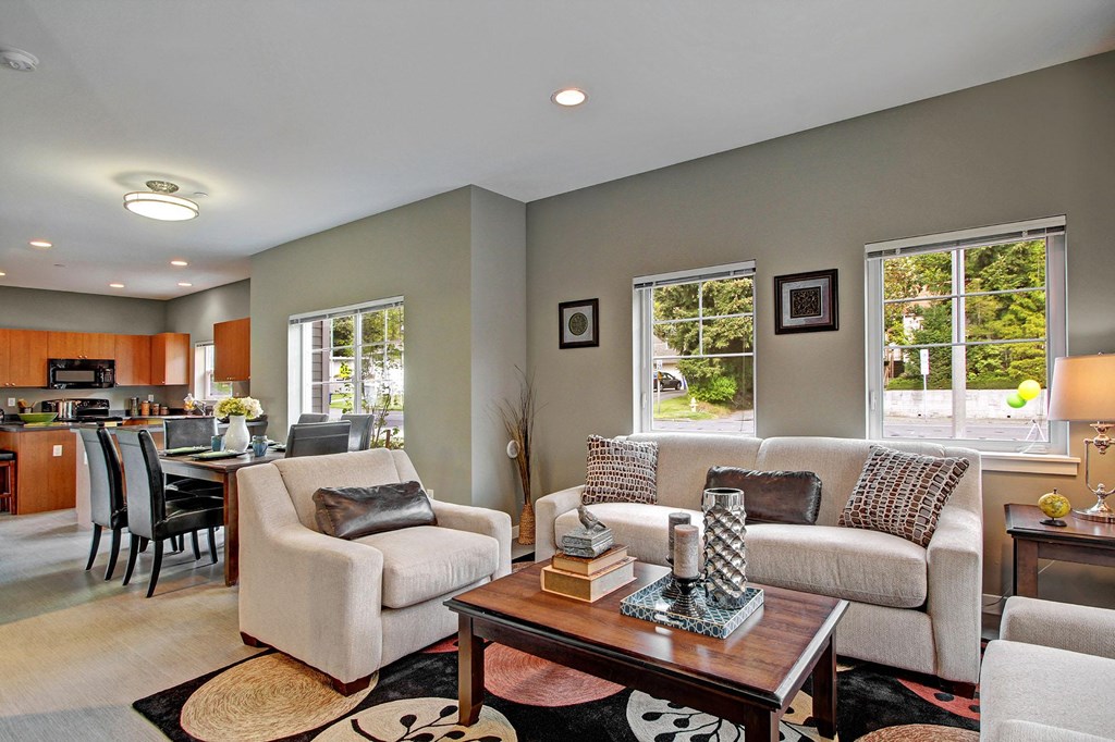 A living room with a couch, chair, and coffee table.