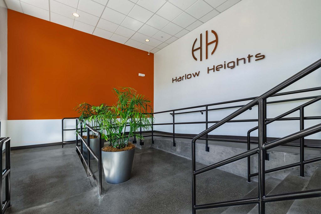 A plant sits in a pot on a staircase.