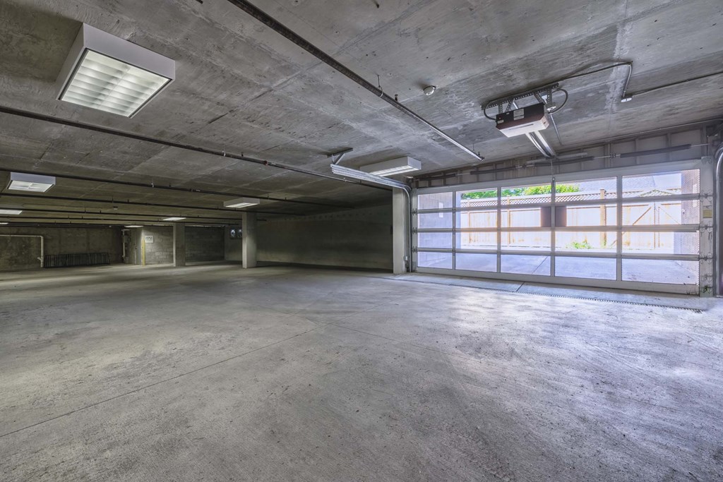A large, empty warehouse with concrete floors and walls.