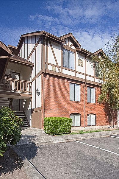 A building with a red brick facade and white trim.