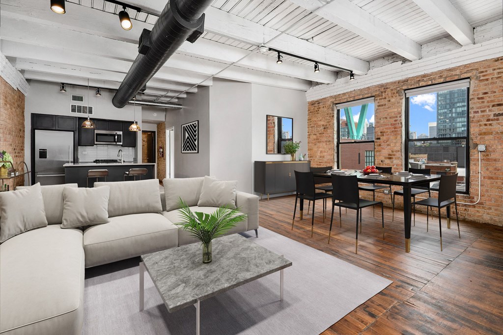 a living room with a white couch and a table with chairs