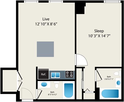 A floor plan of a small apartment with a living room, sleeping area, and two bathrooms.