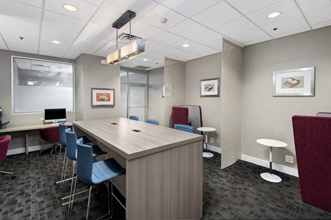 a meeting room with a long table and chairs