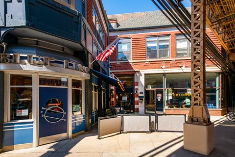 a street view of a building with an flag on the side of it