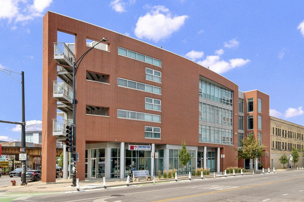 a large brick building on the side of a street