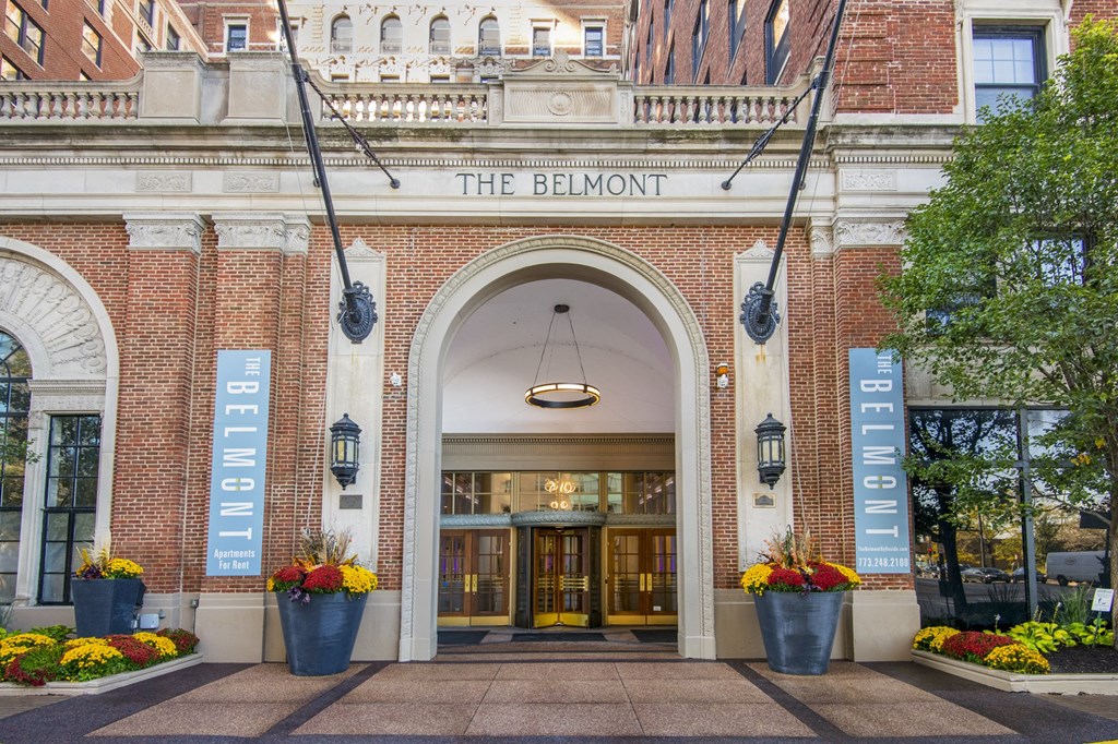 the bellmont hotel entrance with flowers in front of it