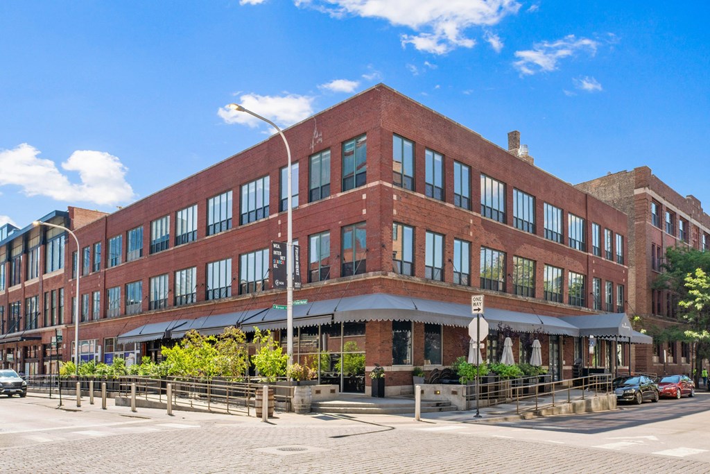a large red brick building on a city street