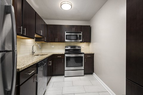 Kitchen at Park Lincoln with Brown Cabinets