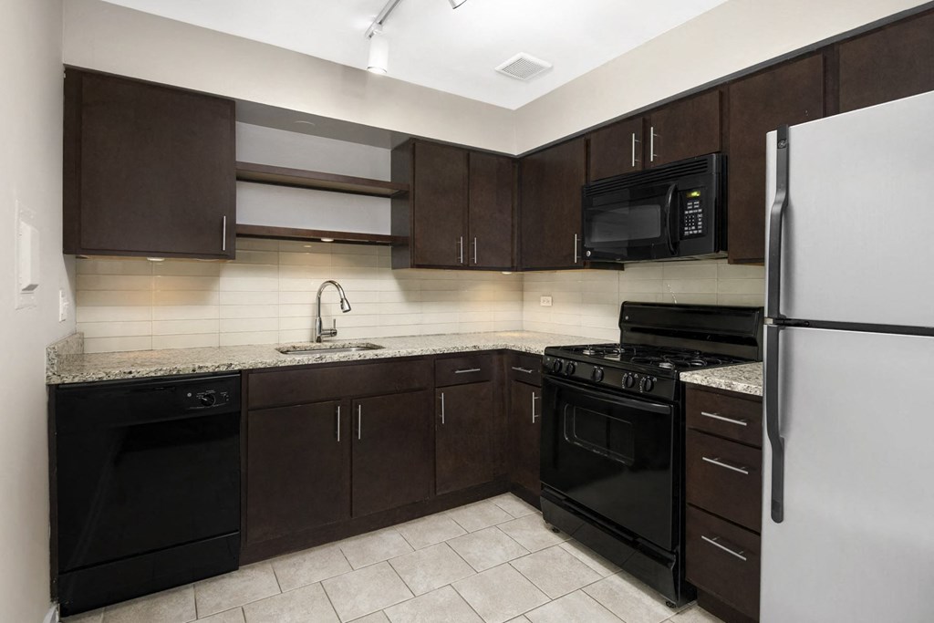 Kitchen at Reside 707 with Brown Cabinets