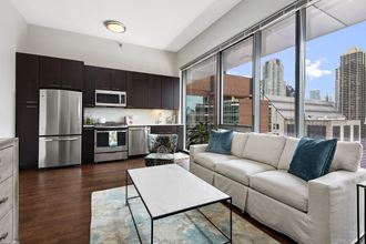 Living Room with Floor to Ceiling Window Chicago Apartment 60610