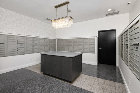 a locker room with rows of lockers and a table in the middle